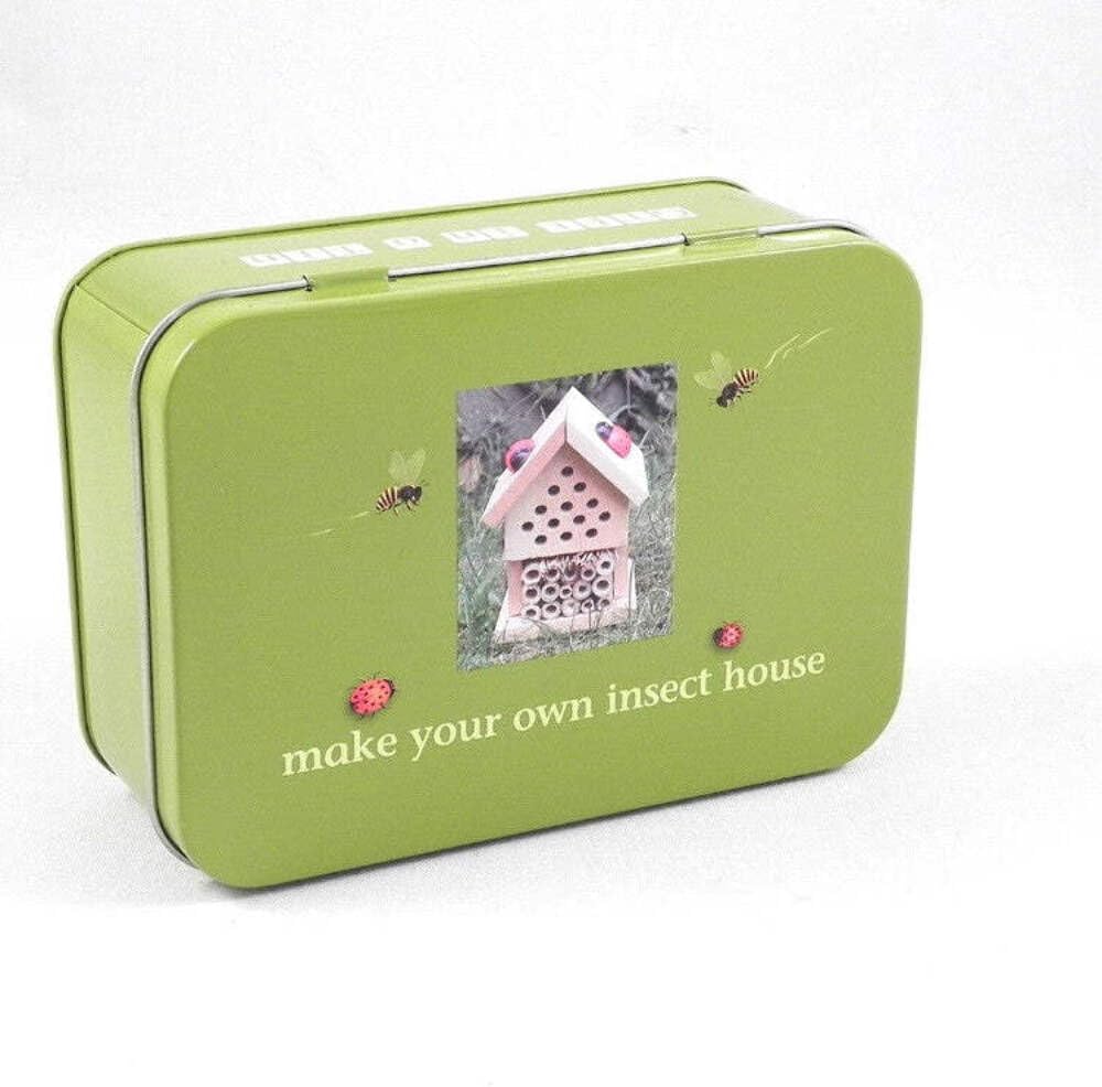 Green tin box with a picture of an insect house on a white background