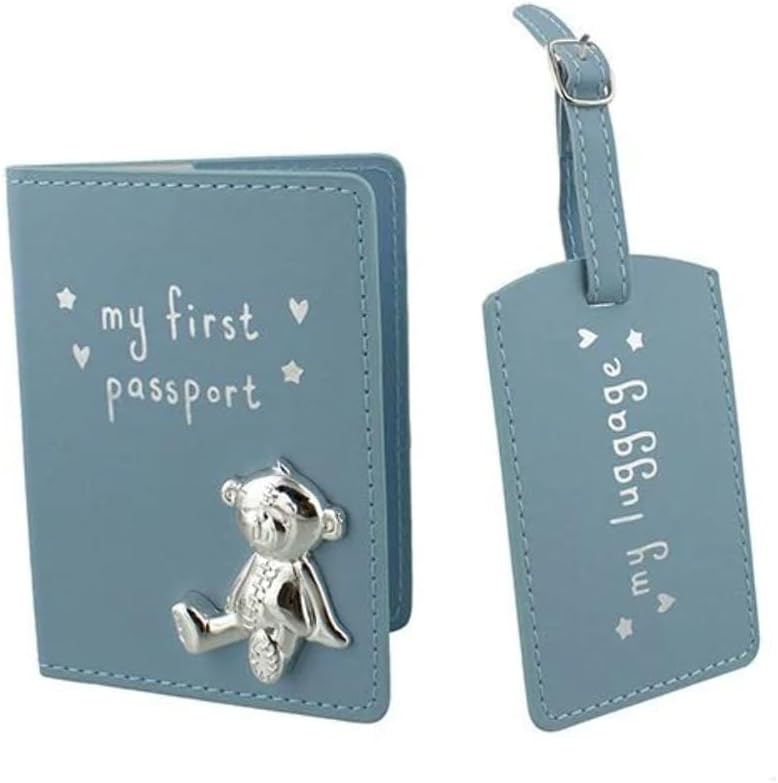 Blue 'my first passport' holder with teddy bear charm and matching 'my luggage' tag on a white background