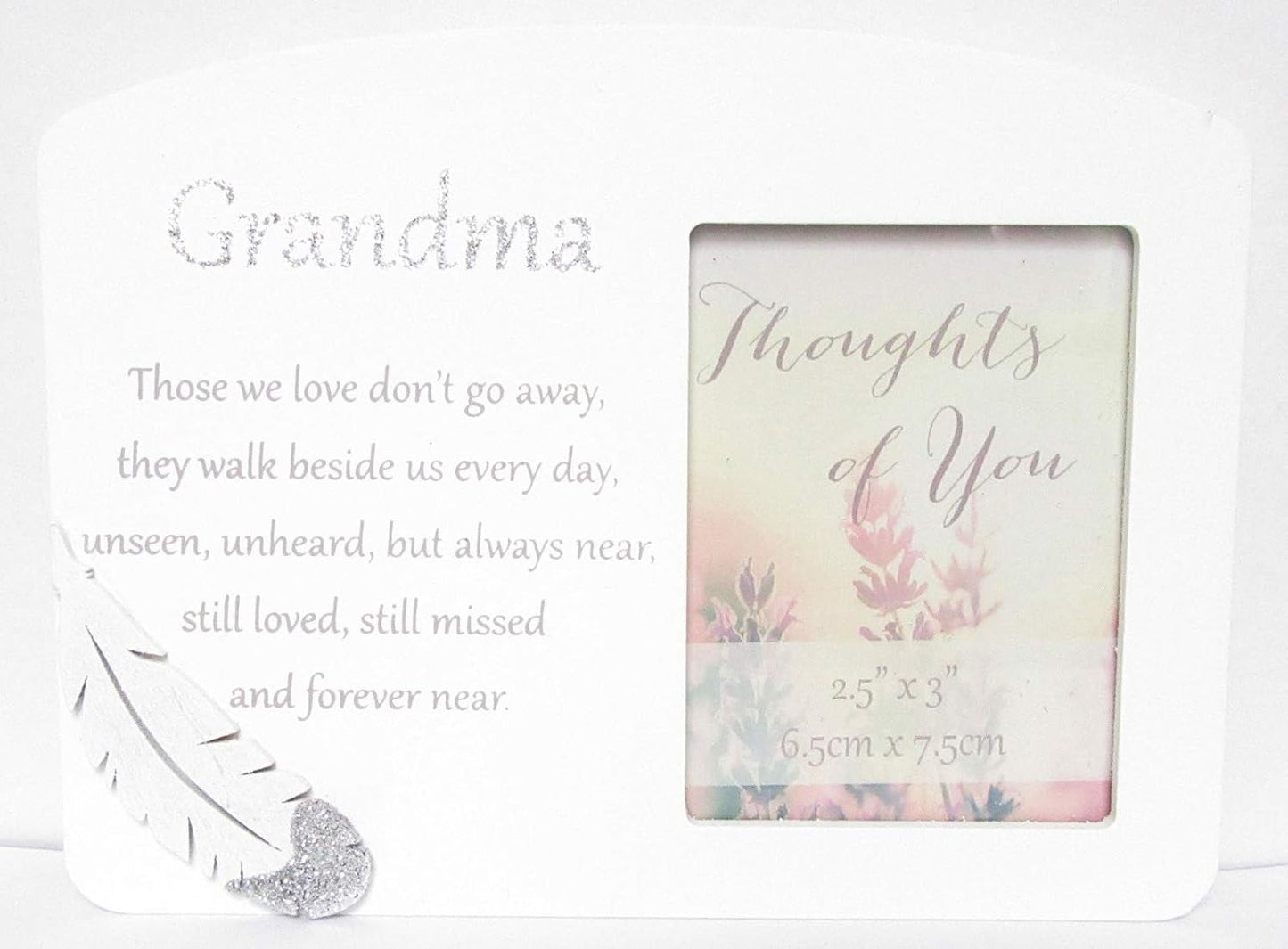 Memorial photo frame with floral design and text on a white background