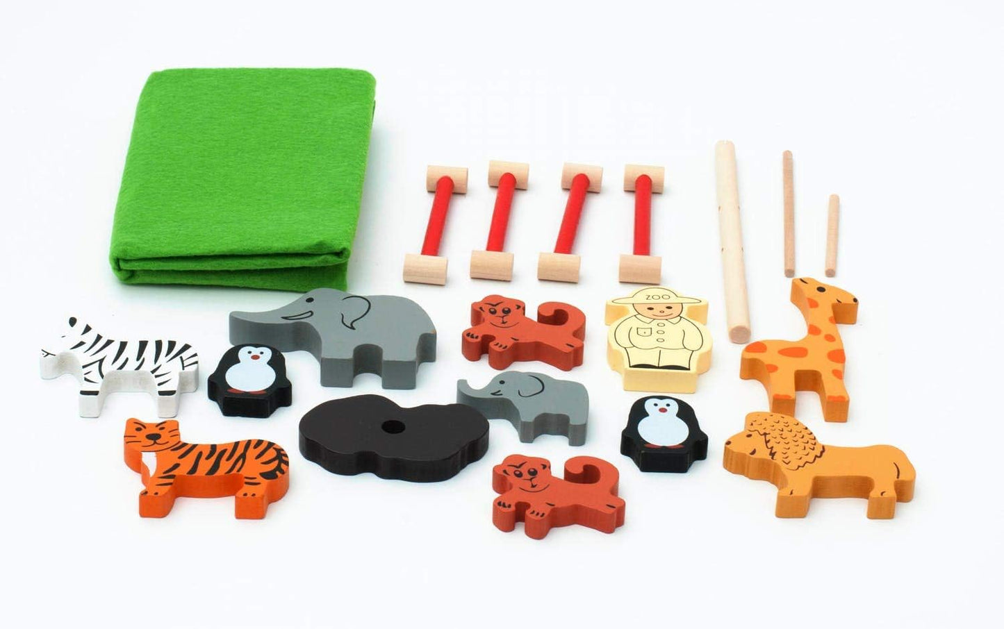 Set of colorful animal-shaped wooden toys with a green felt mat on a white background