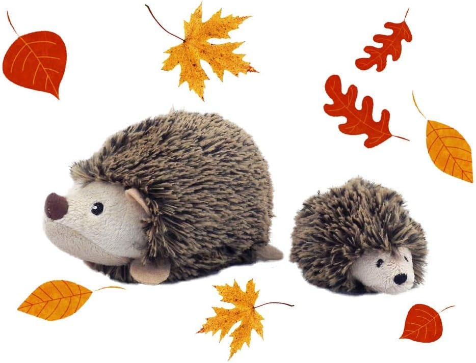 Two plush hedgehogs with autumn leaves on a white background