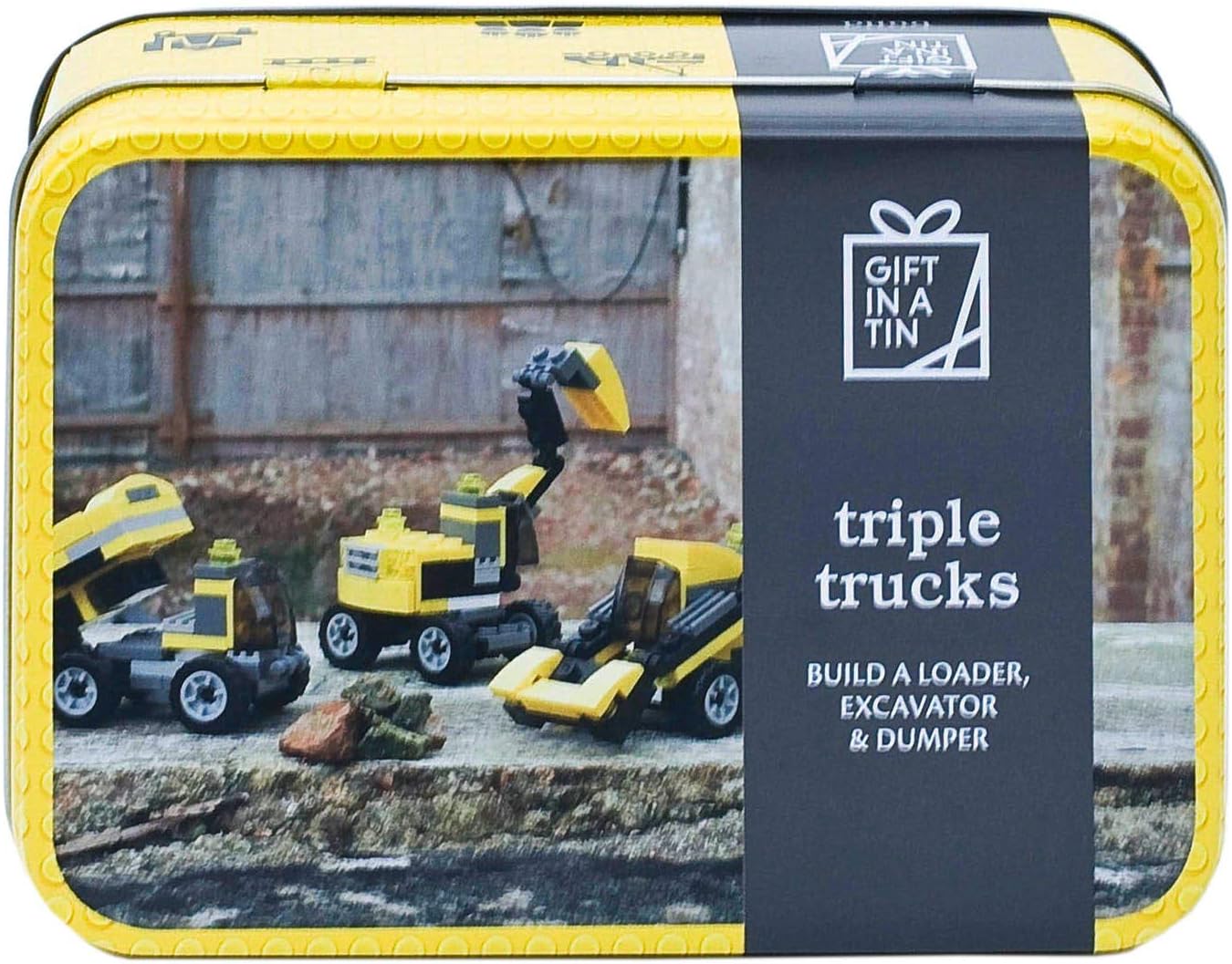 Toy truck set packaging with 'Gift in a Tin' branding on a yellow and black box.