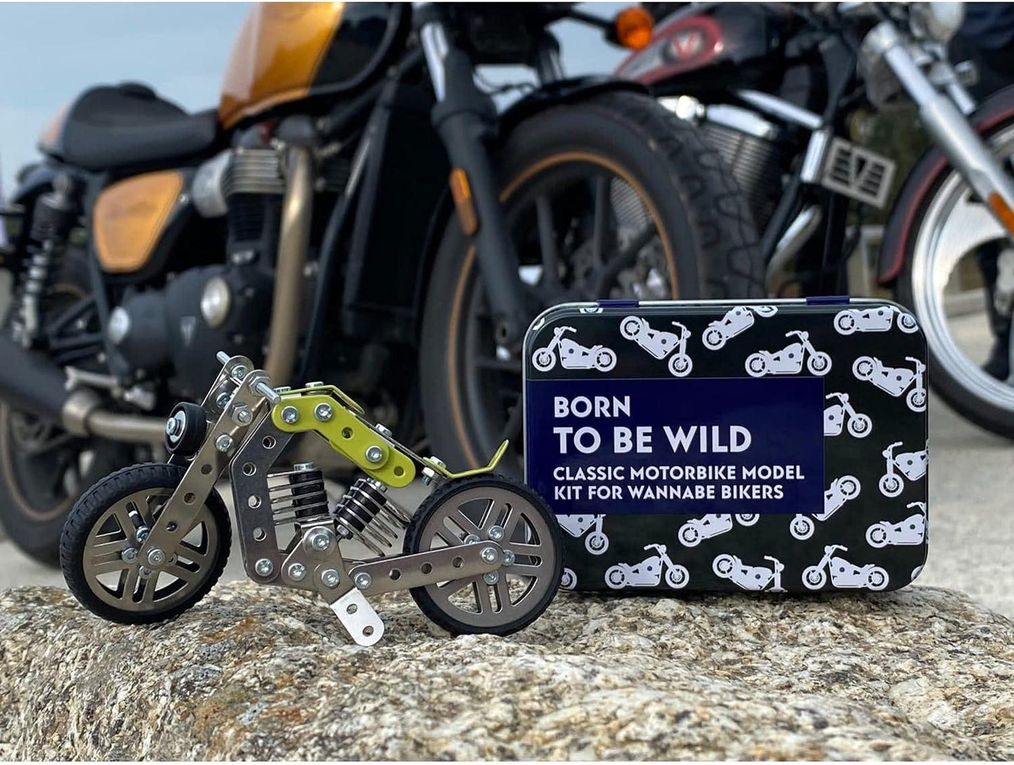 Model motorcycle kit with packaging labeled 'Born to be Wild' in front of motorcycles.
