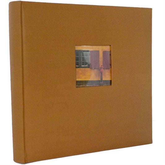 A brown traditional photo album with a front cover showing a small photograph aperture, bookbound design, and a spine visible on the side.