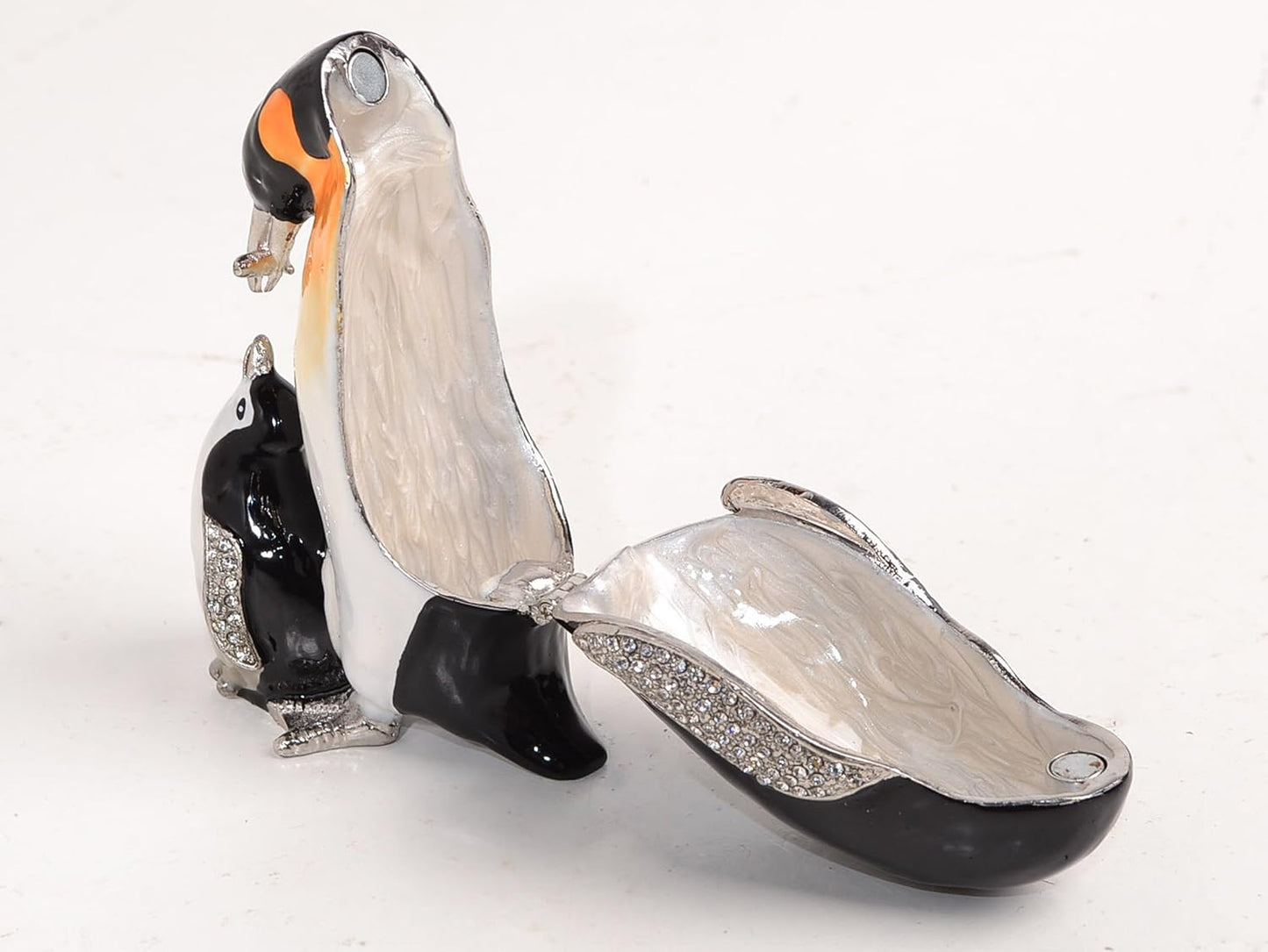 Decorative glass penguins on a white background