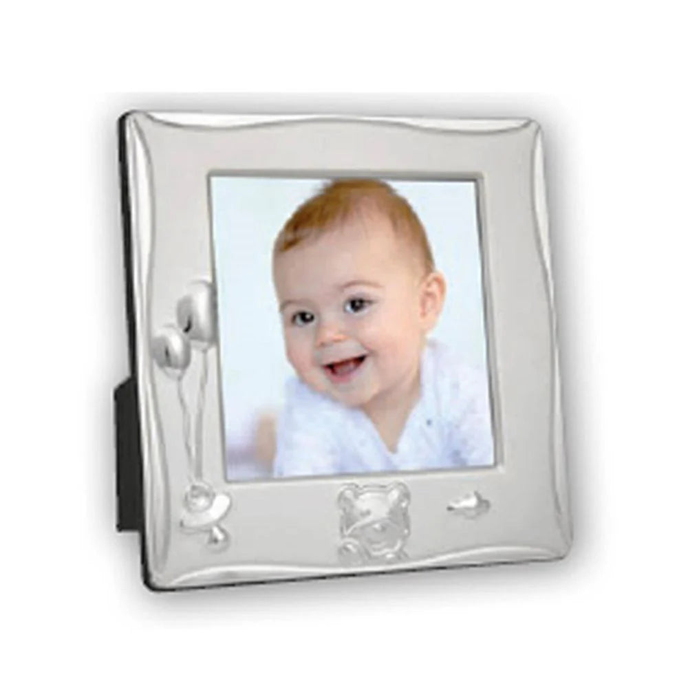 Silver photo frame with a baby's picture on a white background