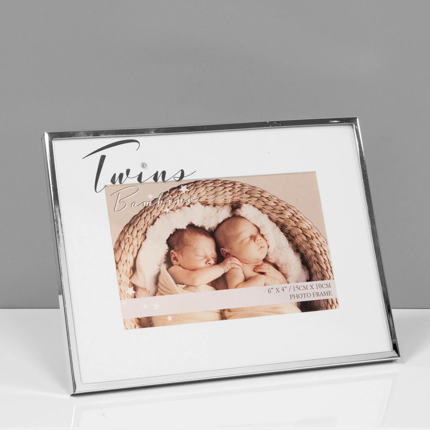 Photo frame with a picture of twins and text 'Twins' on a gray background