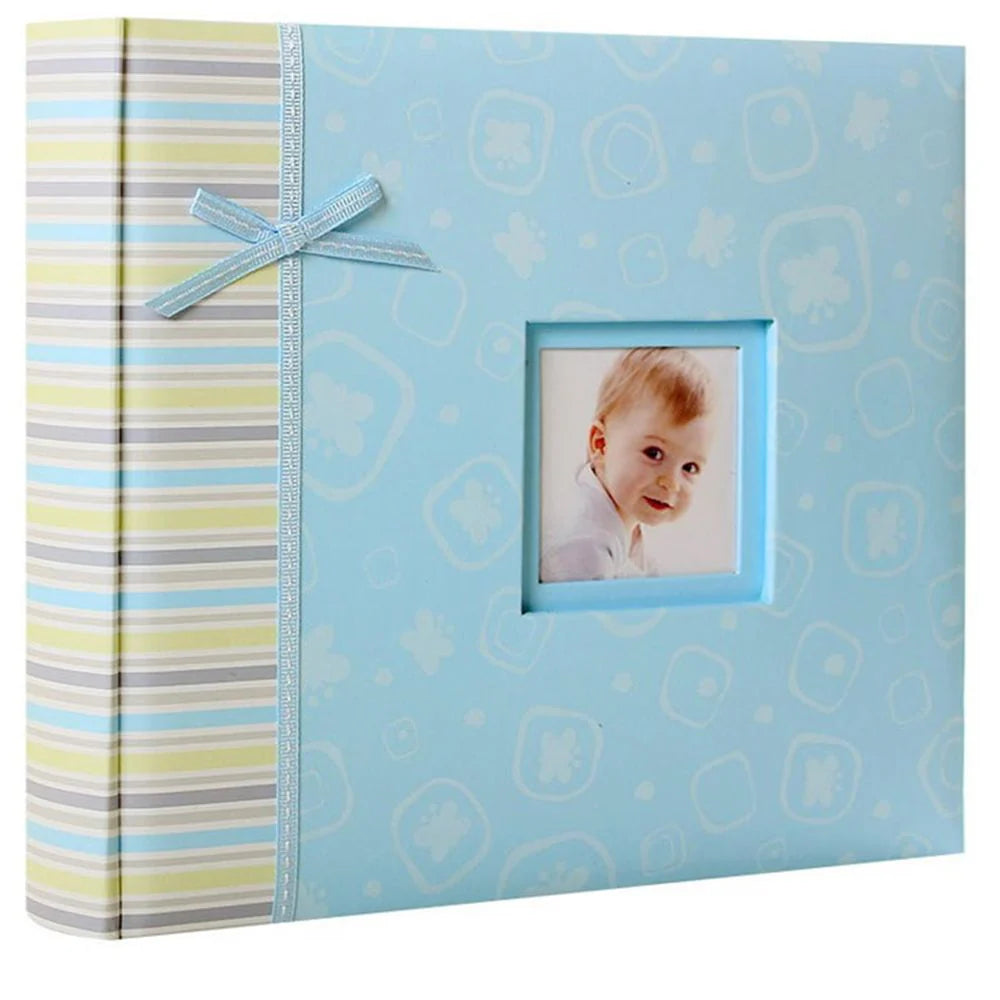 Blue photo album with a baby picture on a white background