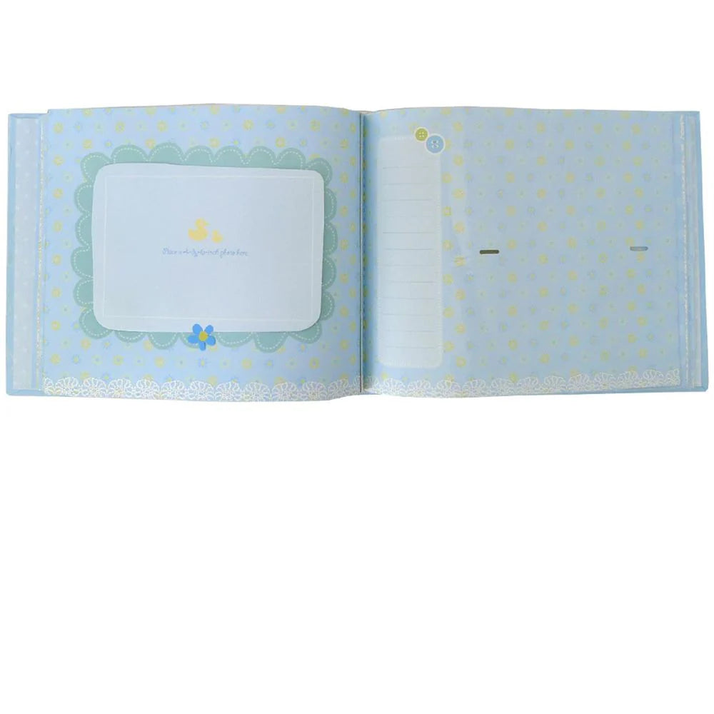 Open book with light blue cover featuring floral patterns on a white background