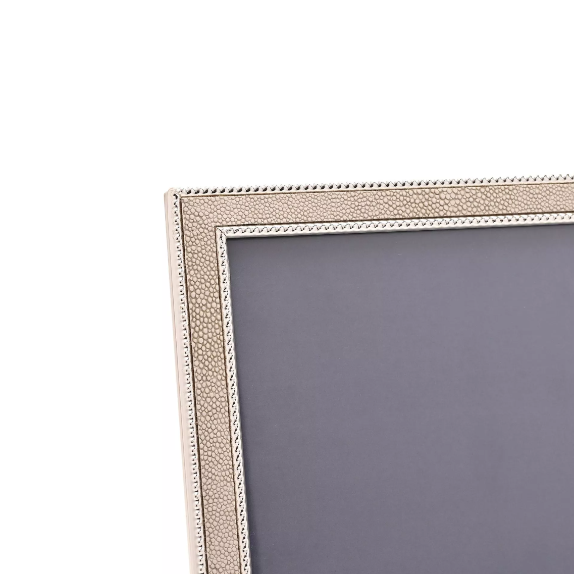 Silver picture frame with a textured border on a white background