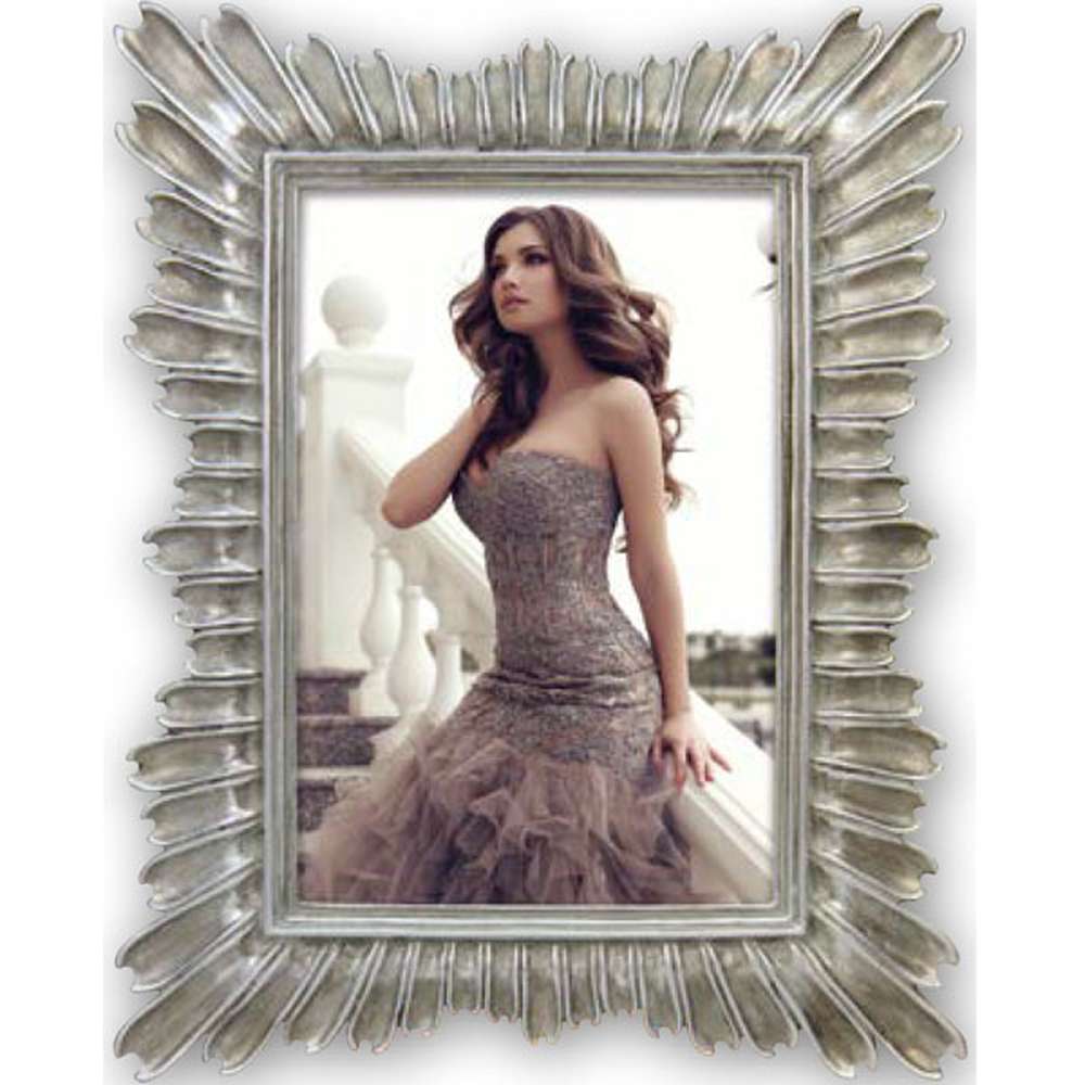 A grey metal photo frame with a clear glass cover, showcasing a photo of a woman. The frame has a decorative metallic design and is designed to hold a 6x4 inch photo.