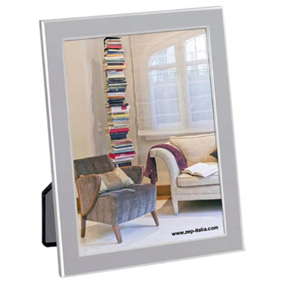 Silver photo frame displaying a living room scene with books and furniture.