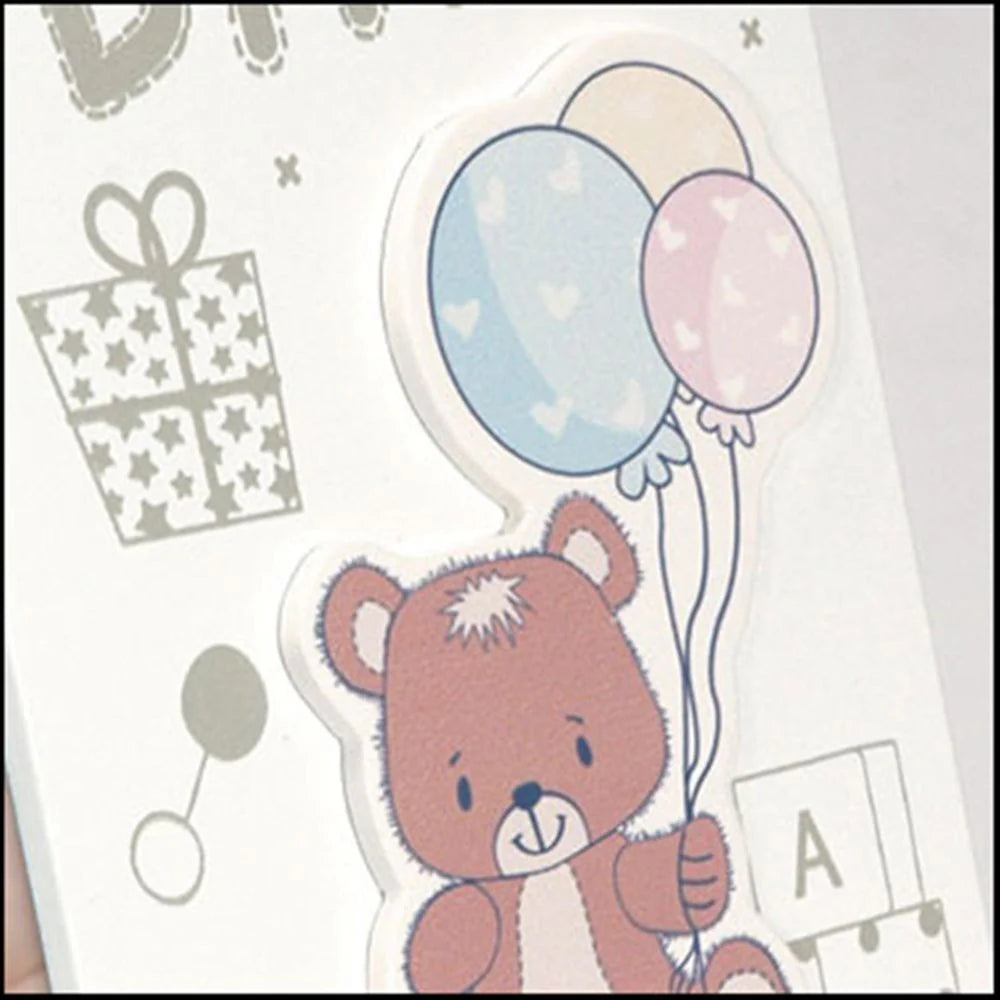 Sticker of a bear holding balloons with a gift and letter 'A' on a light gray background