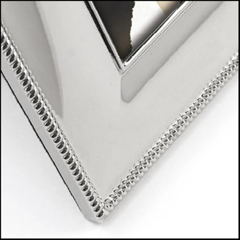 Close-up of a silver photo frame corner with a white background