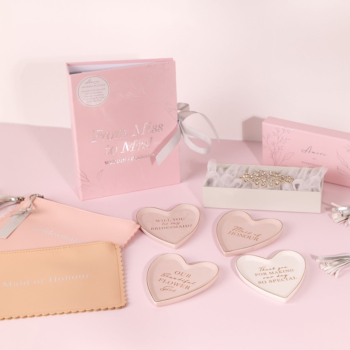 wedding selection of gifts on pink cloth