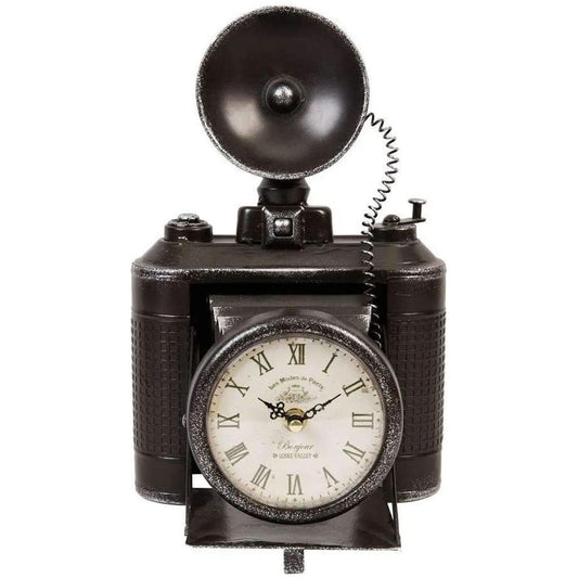 A vintage-style black metal mantel clock designed to resemble a camera with a flash on top.