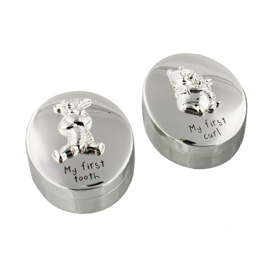Winnie the Pooh and Tigger on separate silver boxes, my first tooth, my first curl