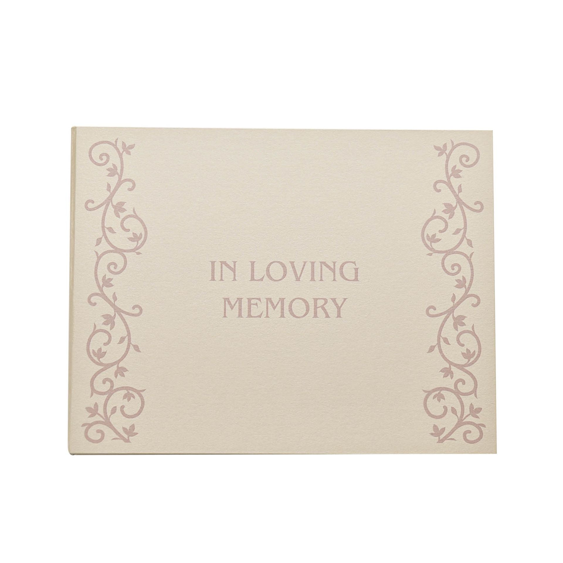 A cream-colored book with a decorative font and floral patterns, titled 'In Loving Memory' on the cover.