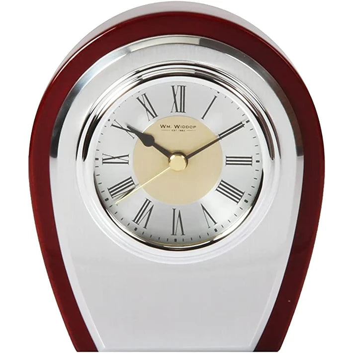 A high gloss piano finish mantel clock with brushed aluminium details and a chrome finish bezel, featuring analog display with Roman numerals.