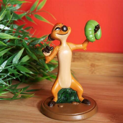 A resin figurine of Timon from The Lion King, holding a green grub, with a round base for standing.