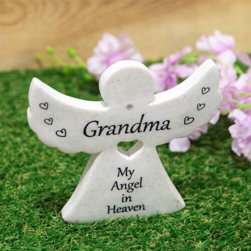 White marble-finished resin angel memorial with 'GRANDMA - MY ANGEL IN HEAVEN' inscription, adorned with clear crystal details.
