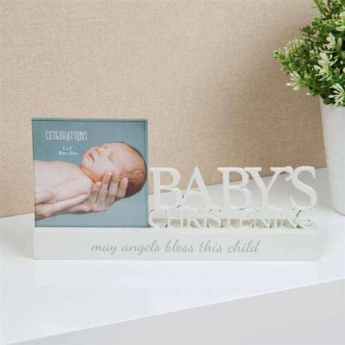 A white rectangular photo frame with a baby image and the text 'CELEBRATIONS' and 'BABY'S CHRISTENING' on it, placed on a table.