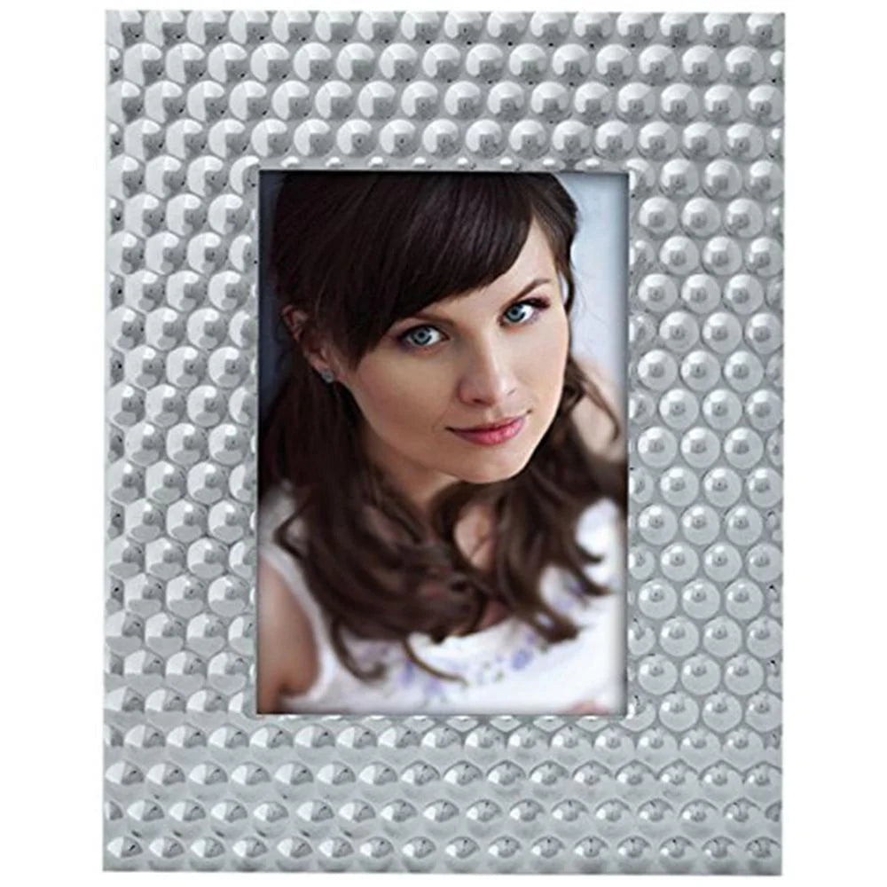 Silver beaded photo frame with a portrait of a woman inside