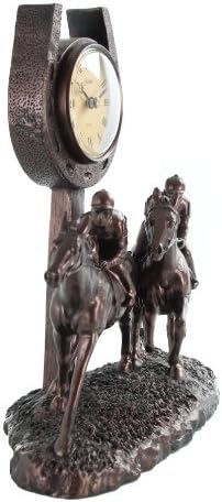 side on profile of horses racing with clock in horseshoe above it 
