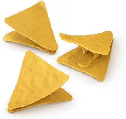 Three yellow triangular clips on a white background