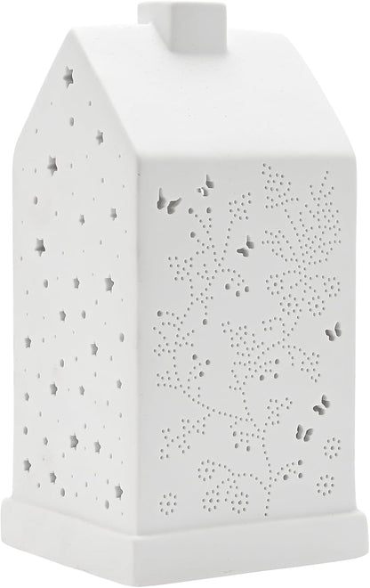 A white ceramic house-shaped night light with star and floral cutout patterns, shown on a plain white background.