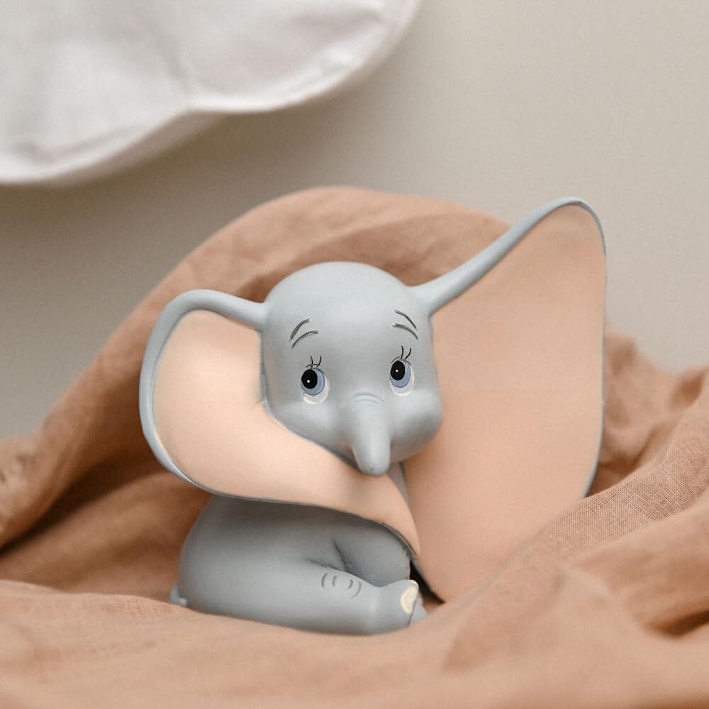Dumbo in a peachy brown sheet