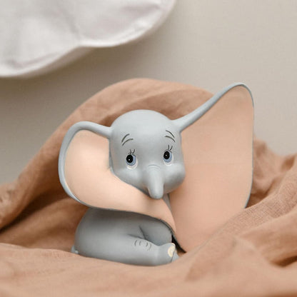 Dumbo in a peachy brown sheet