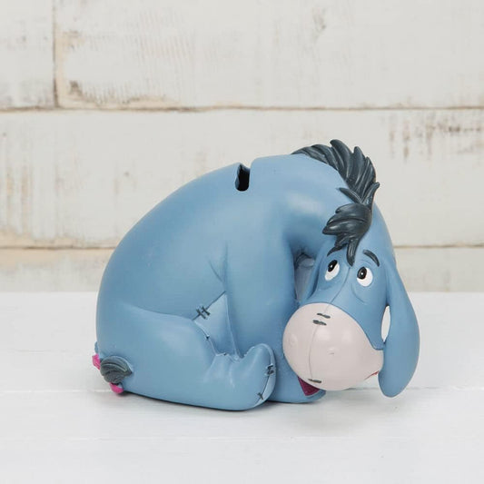 Eeyore Dumbo Money Box in front of brick wall