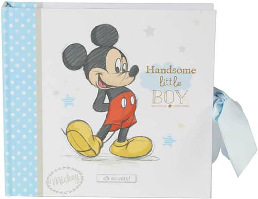 Book with a cartoon character on the cover, featuring text and a ribbon.