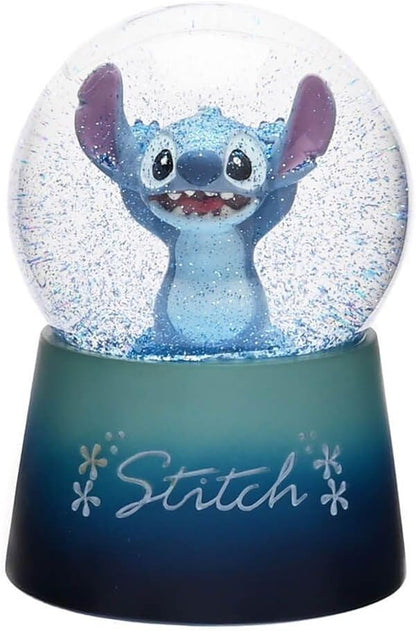 Snow globe with a character inside on a blue base, featuring the word 'Stitch'.