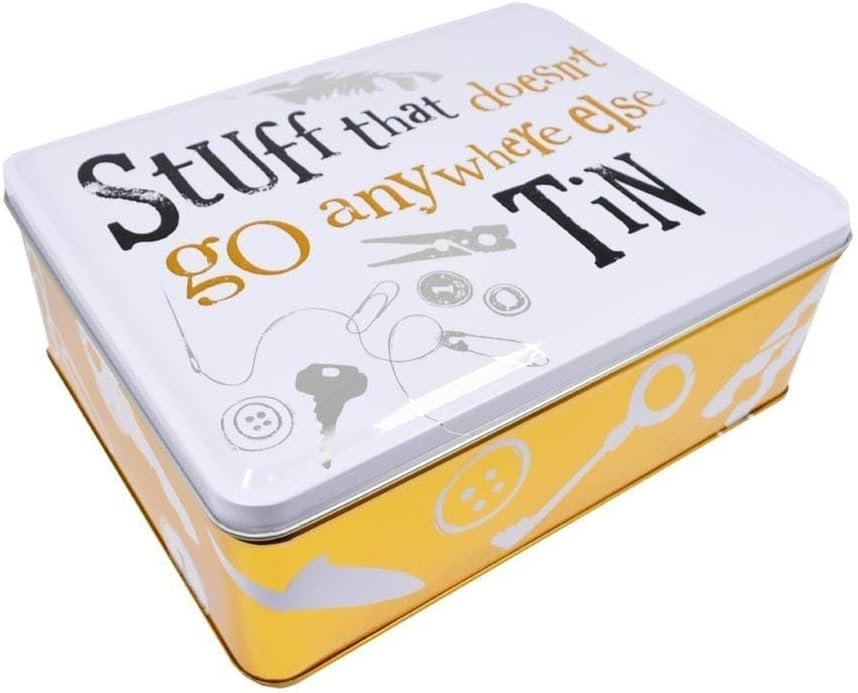 Metal tin with text 'Stuff that doesn't go anywhere else' on a white background