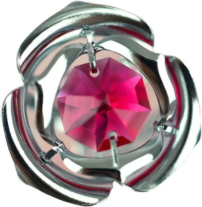 Silver Rose with a pink gemstone on a white background