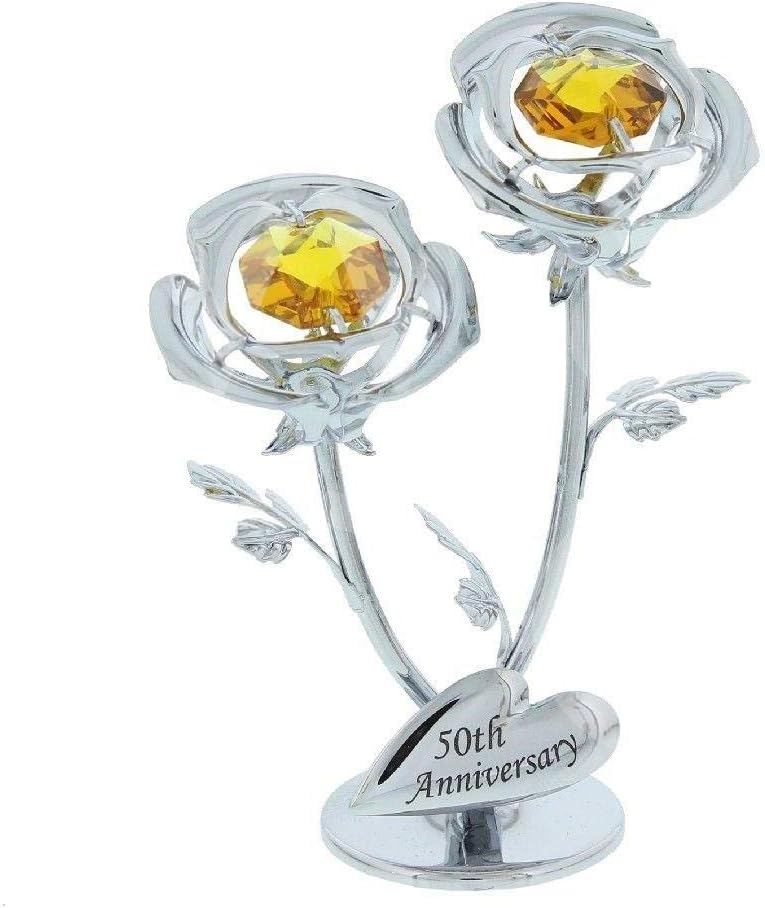 Silver rose-shaped ornament with yellow gemstones and '50th Anniversary' text on a white background