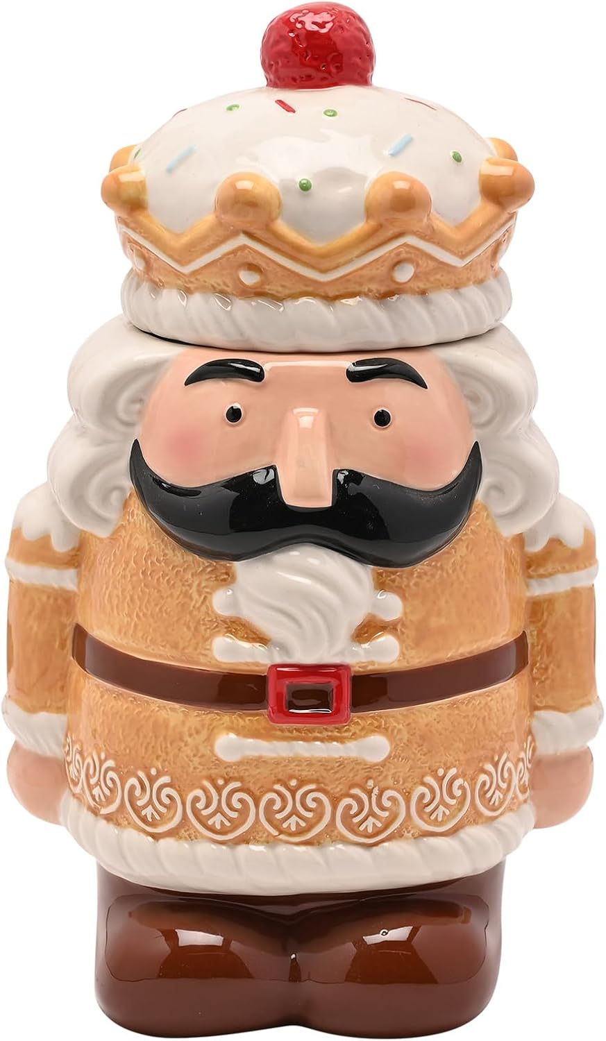 A ceramic nutcracker-style figurine with a white beard, black moustache, tan and white outfit, brown boots, and a red cherry on top of the hat, shown on a plain white background.
