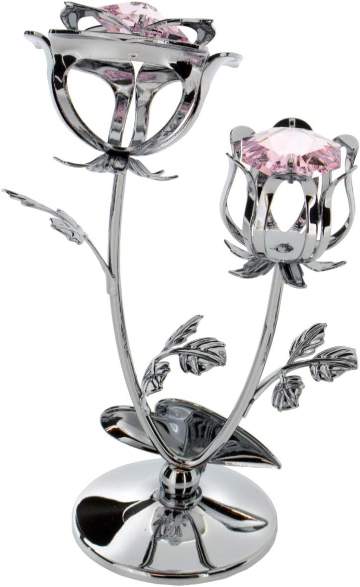 Decorative rose with pink gemstones on a white background