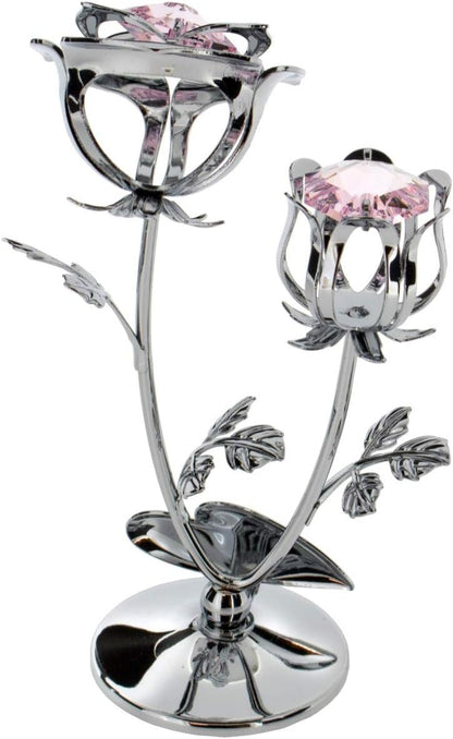 Decorative rose with pink gemstones on a white background