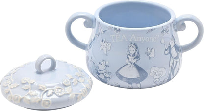 Light blue ceramic sugar bowl and lid with decorative patterns on a white background