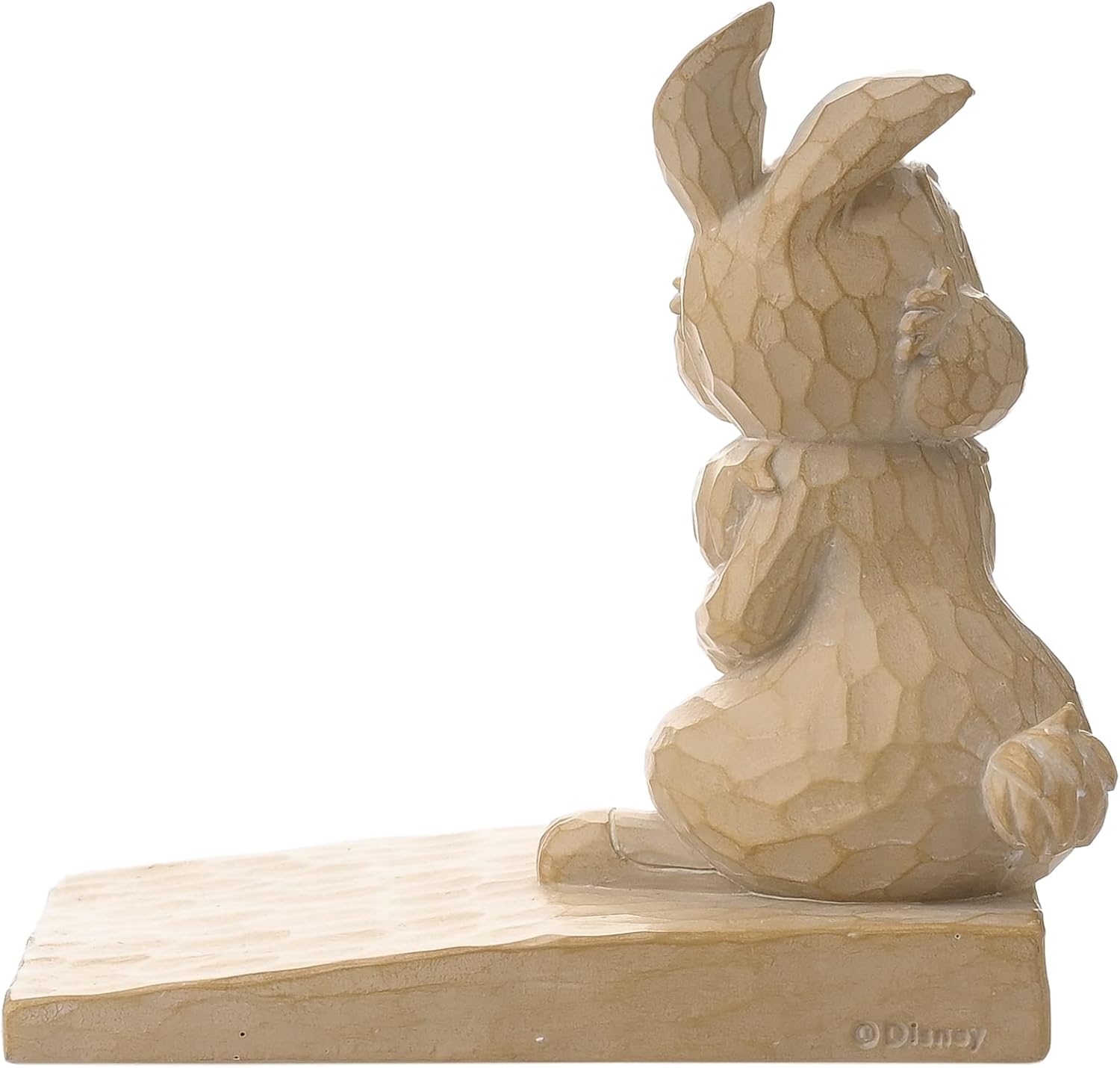 Wooden rabbit figurine on a white background