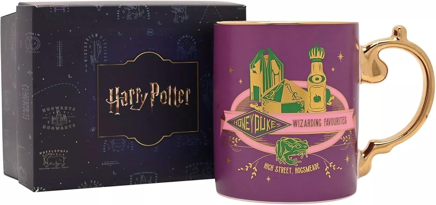 A purple Harry Potter Honeyduke Wizarding Favourite mug with a gold handle and gold rim, shown next to its dark blue branded gift box.