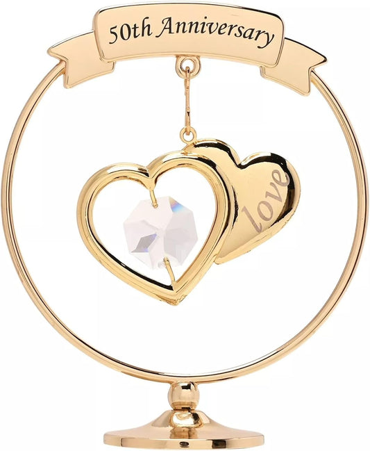 Gold 50th Anniversary heart-shaped ornament with a crystal center on a white background