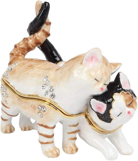 Decorative figurine of two cats with a trinket box, one cat is striped and the other is black and white.