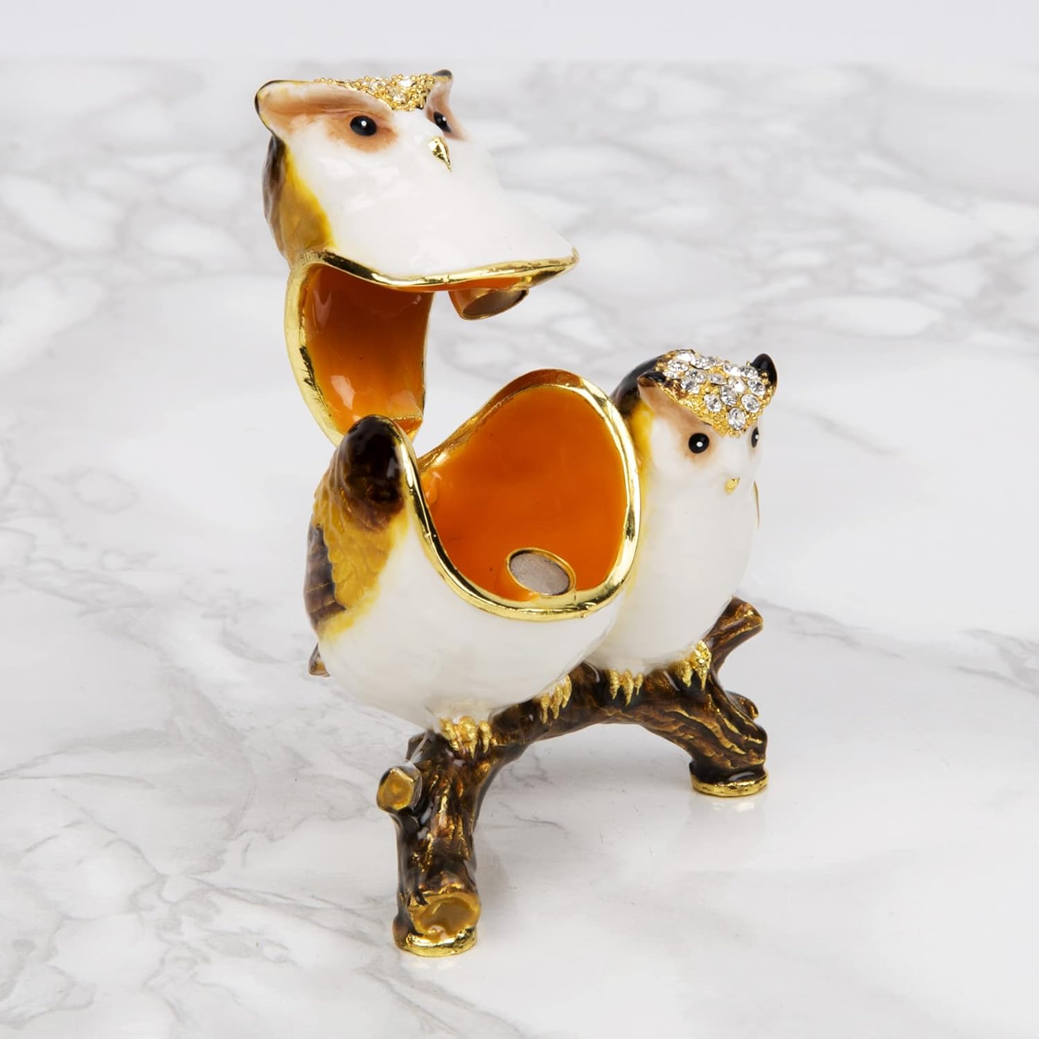 Decorative owl figurine with jewelled hats on a white background open 