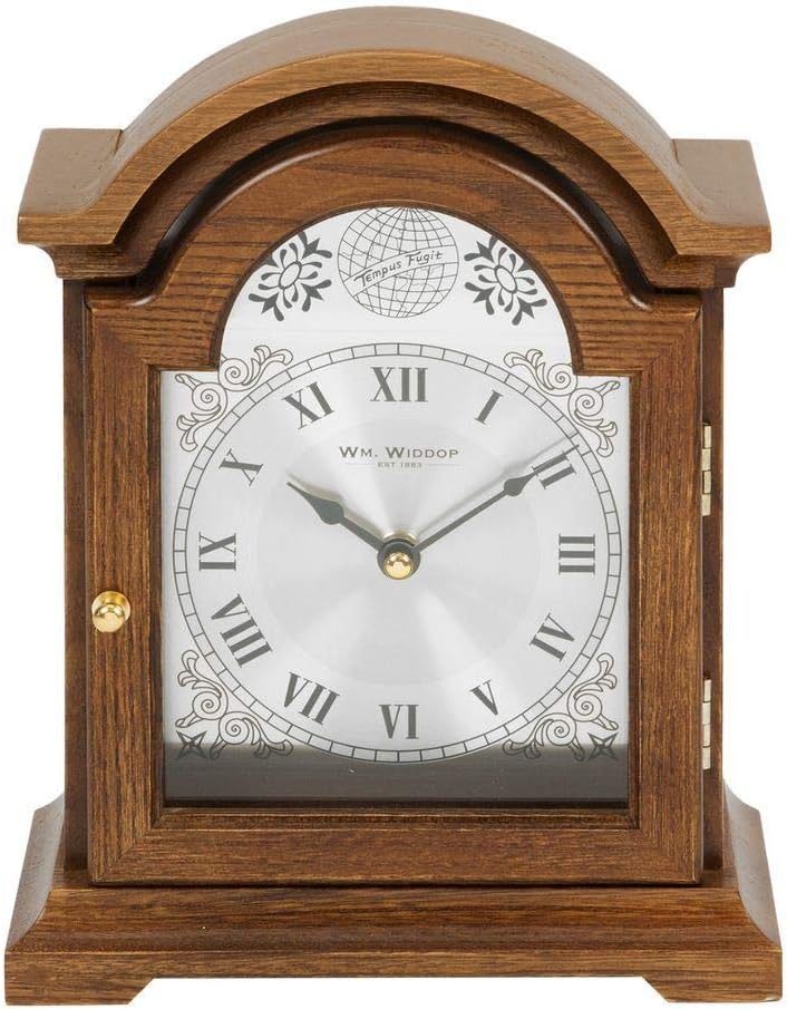 Wooden clock with decorative face on a white background