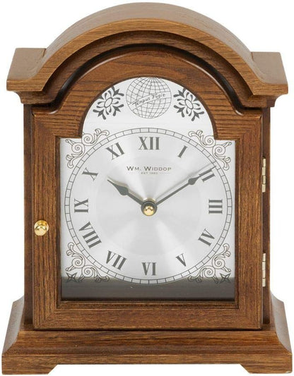 Wooden clock with decorative face on a white background
