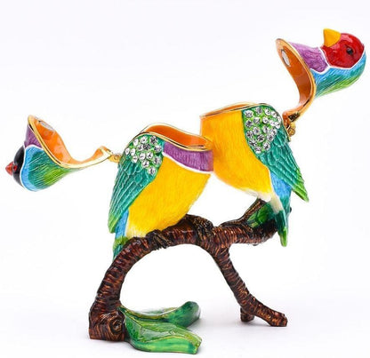 Colorful bird figurine on a branch with decorative elements